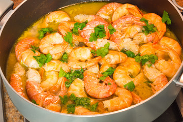 Shrimp cooking with parsley