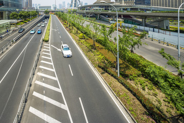 cityscape of shanghai and traffic on road