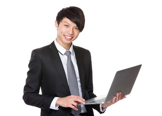 Asian Young businessman use of the notebook computer