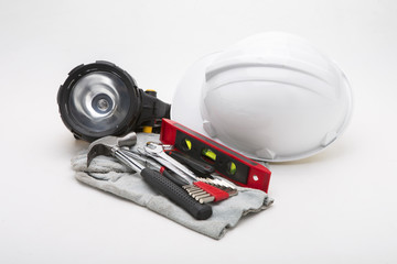 construction equipment  hat ,hammer flashlight on a white background