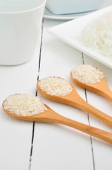 rice grain on wooden spoon.