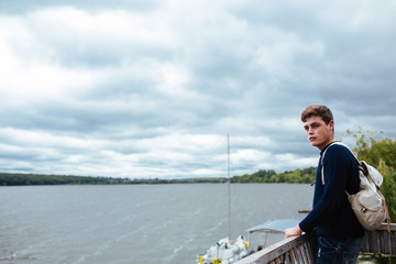 man standing on a pier