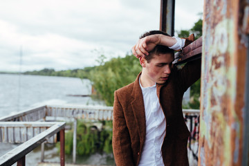 man standing on a pier