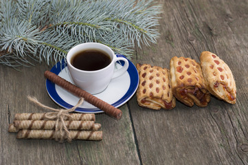 cup of coffee, cookies and fir-tree branch