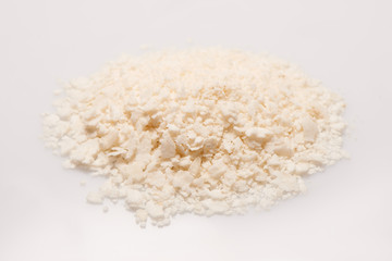 Pile of rice flakes on the white background