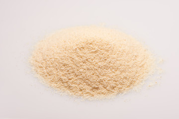 Pile of semolina croup on the white background