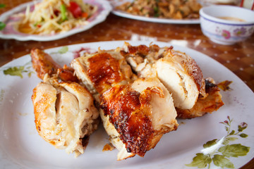 Grilled chicken on plate.