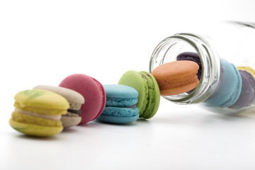 traditional french colorful macarons in glass bottles