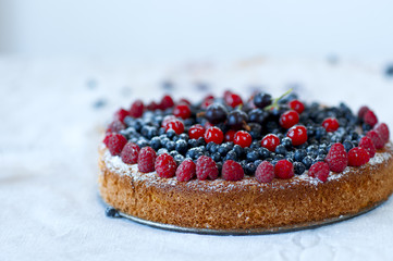 Homemade pound cake garnished with fresh berries.