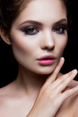 Fototapeta na wymiar Close-up portrait of beautiful woman with bright make-up