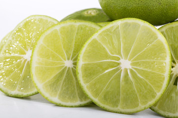 lime slice and lemon on white background