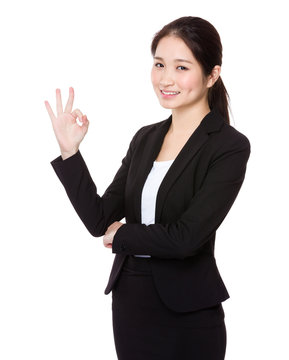 Businesswoman with ok sign gesture