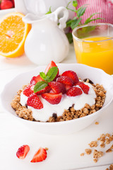 Yogurt with granola and fresh strawberries