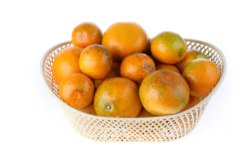orange fruit in basket, isolated on white background