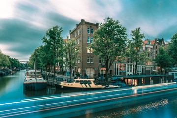 Fototapeta na wymiar Night Amsterdam canal and luminous track