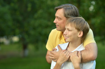 Obraz premium Father and son in summer park
