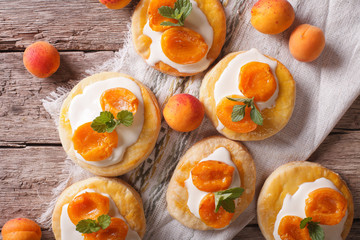 Homemade apricot biscuits with cream closeup horizontal top view

