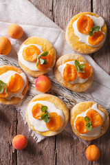 Homemade apricot cookies with a delicate cream vertical top view
