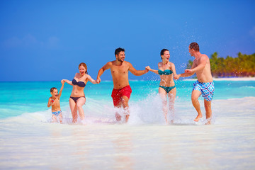 happy people on vacation at tropical island