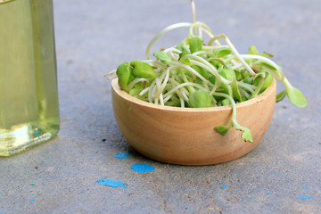 Sunflower oil and young green seedlings.