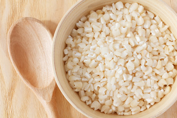 White grated corn kernels in  bowl