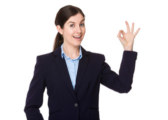 Young businesswoman with ok sign gesture