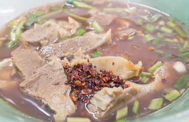 Spicy slow cooked herbal pork serve together with blood soup.