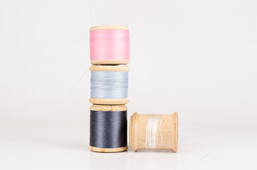 Vintage wooden thread spool with isolated on white background
