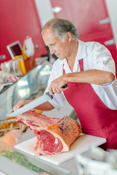 Butcher preparing chops