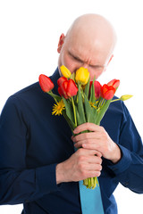 young man with bunch of tulips