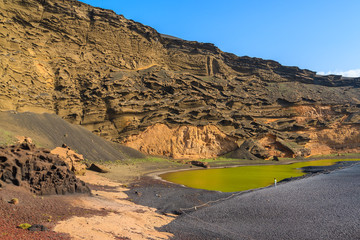 View of famous green water Lago Verde lake, El Golfo, Lanzarote, Canary Islands, Spain