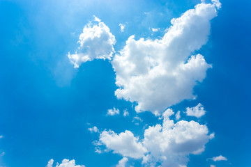 white fluffy clouds in the blue sky