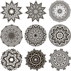 Drawing of a set of black and white mandalas in indian style