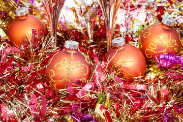 glasses, red Xmass balls on blur background