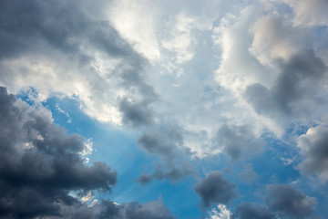 Naklejka na ściany i meble Dark clouds across the blue sky before heavy rain