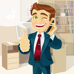 Business man in office reported good news on the phone and shows