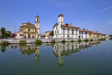 Fototapeta na wymiar gaggiano sul naviglio in provincia milano lombardia italia chiesa san invenzio e la torre