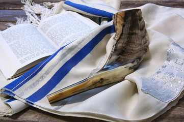 shofar (horn) on white prayer talit. jewish holiday concept