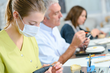Busy dentist with a patient