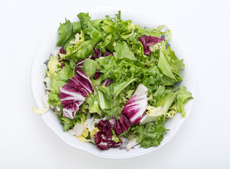  Green and red leaf of lettuce . Isolated on a white background