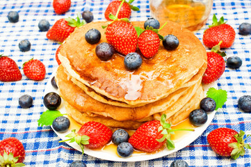 pancakes with fresh berries and honey