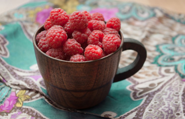 raspberries in wooden bowl