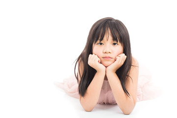 Little asian cute girl laying on floor with bored emotion on face isolated on white background
