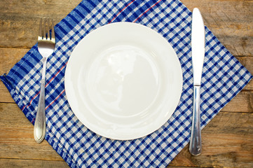 cutlery and a white plate