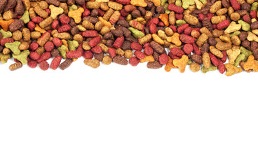 Dry multicolored pet food (dog or cat) on white background