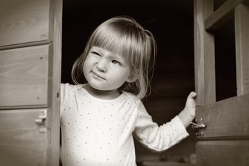Little girl in sepia tones.