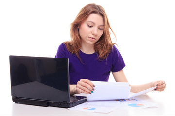 Young girl working at her desk