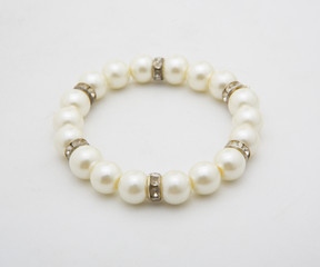 Pearl bracelet of white on a white background