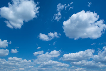 Obraz na płótnie Canvas Blue sky with curly clouds