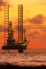 Offshore drilling rig at sunset